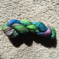 Light Peacock on a base of Franklin Valley Cone Yarns - Superwash